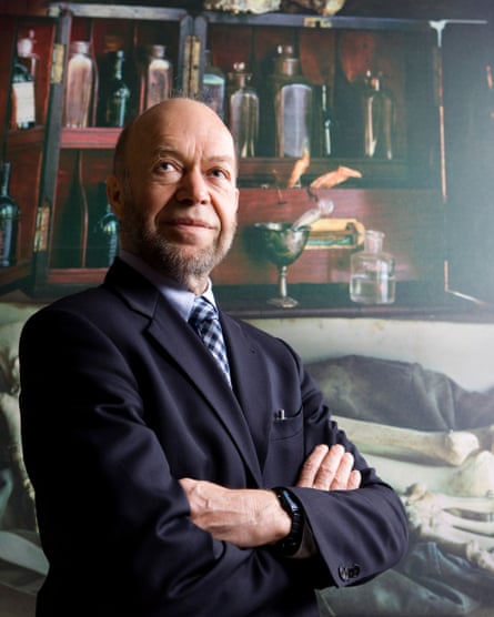 James Hansen poses for a photograph with his arms crossed