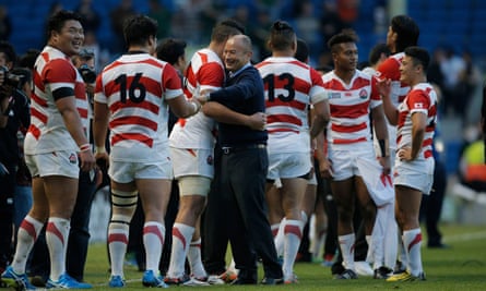 Eddie Jones congratulates his Japan players after their historic win over South Africa at the 2015 World Cup