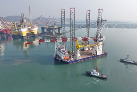 A tugboat pulling a wind power installation ship to sea in Shandong Province, China in on 2 January 2024. 