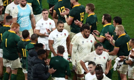 England players look dejected as they receive a guard of honour from South Africa players after the 2023 Rugby World Cup semi-final match