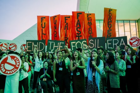 Climate activists protest against fossil fuels at Cop28 in Dubai, United Arab Emirates, 12 December 2023.