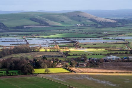View across flooded fields to Mount Caburn on the South Downs