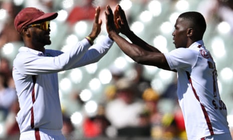West Indies’ Shamar Joseph (R) celebrates the wicket of Marnus Labuschagne on day one.