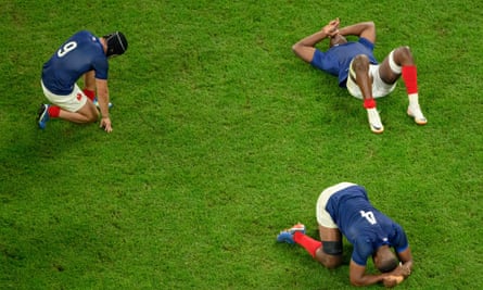 Distraught France players after their quarter-final defeat by South Africa.