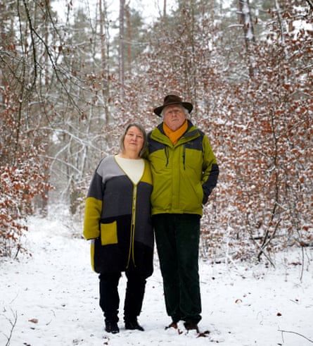Barbara and Kenny Kennerstanding in a clearing in a snowy forest