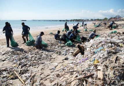 The team is facing the unpleasant task of sorting through dirty diapers to clean up the waterways in Bali, causing discomfort in their stomach.