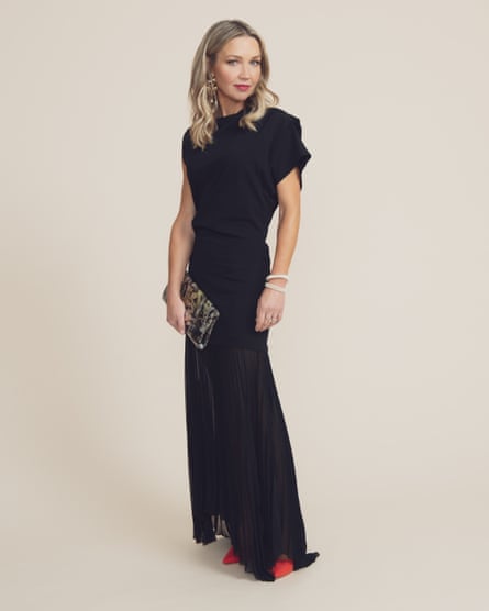 Jess Cartner-Morley in long black dress with clutch bag