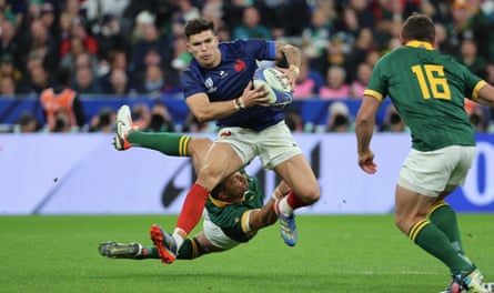 The France fly-half Matthieu Jalibert carries the ball against South Africa.