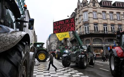 EU agriculture leaders convene in Brussels while farmers engage in a confrontation with riot police.