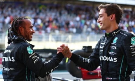 George Russell and Lewis Hamilton in the paddock