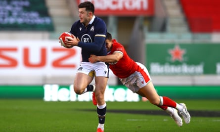 Blair Kinghorn makes a break for Scotland against Wales