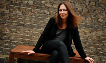 Lorrie Moore poses for a portrait on a bench