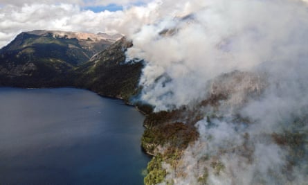 Wildfires at the north slope of Cerro Capitan, at Lake Nahuel Huapi's Brazo Tristeza fjord on the Circuito Chico hiking trail, near Bariloche, Rio Negro, Argentina.