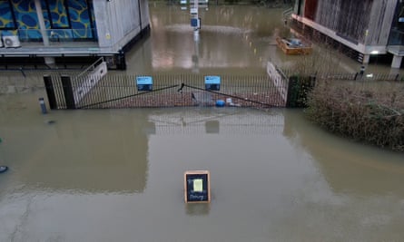 Gates outside the museum submerged in water