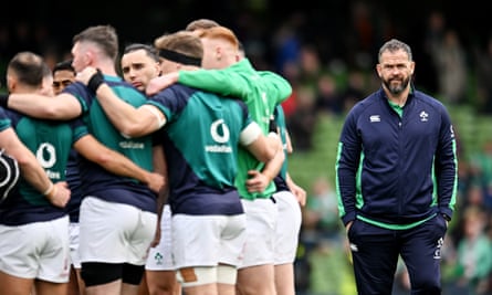 Andy Farrell, head coach of Ireland, looks on as players huddle up in training