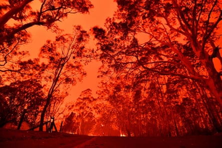 The afternoon sky glows red from bushfires near Nowra, Australia on 31 December 2019