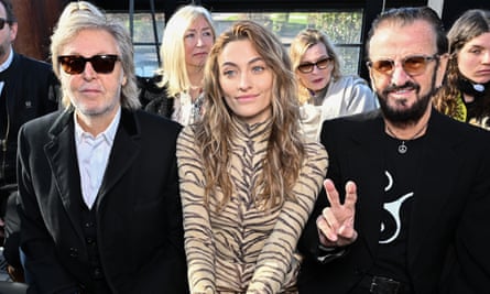 (L-R) Paul McCartney, Paris Jackson and Ringo Starr, who is making a V-sign with his fingers
