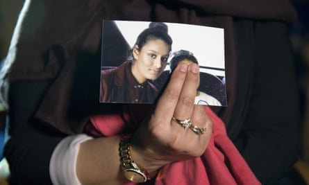 Renu, eldest sister of British girl Shamima Begum, holds a picture of her sister while being interviewed by the media in central London.