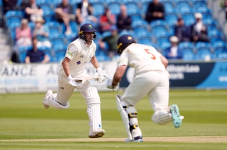Glamorgan’s Billy Root and Kiran Carlson run between the wickets as they bat against Sussex.