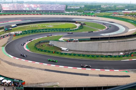 Drivers negotiate the opening turns at the Shanghai International Circuit