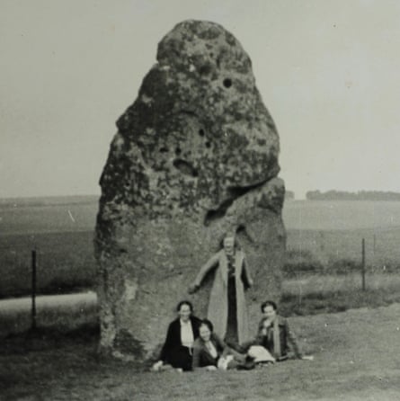 Vintage photograph of four women by the heel stone at Stonehenge
