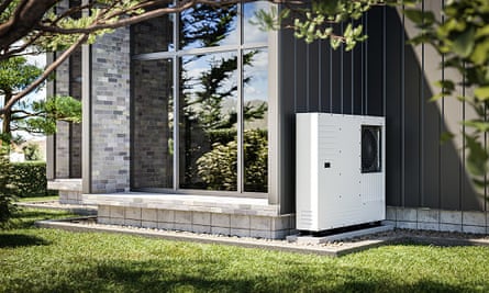 Heat pump installed at the wall of a house