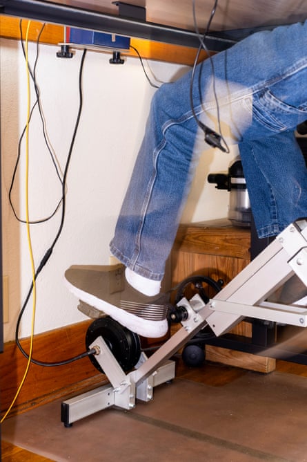 feet use pedals attached to metal base below a desk