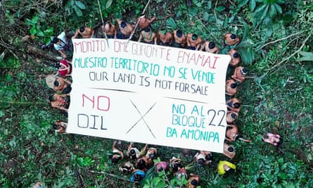 Waorani community members gather to send a message to the world: “Our Land Is Not for Sale”.