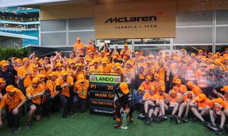 Lando Norris celebrates with the McLaren team