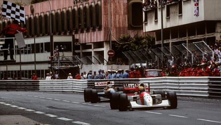 The McLaren-Honda MP4/7A of Ayrton Senna, crosses the line ahead of the Williams-Renault FW14B of Nigel Mansell to win the 1992 Monaco Grand Prix.
