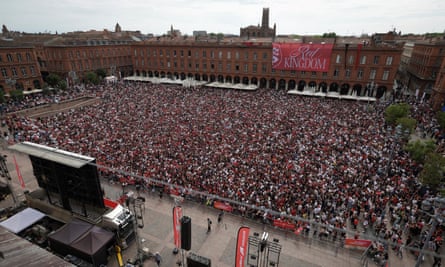 Toulouse supporters celebrate in a fan zone back home at the Place du Capitole