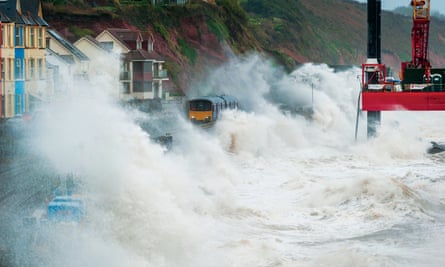 Huge waves crashing against a railway line