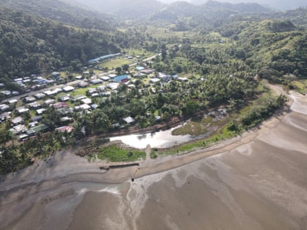 Ratu Filise Rugby Club (top) in the village behind the eroded beach in Namatakula, Fiji.