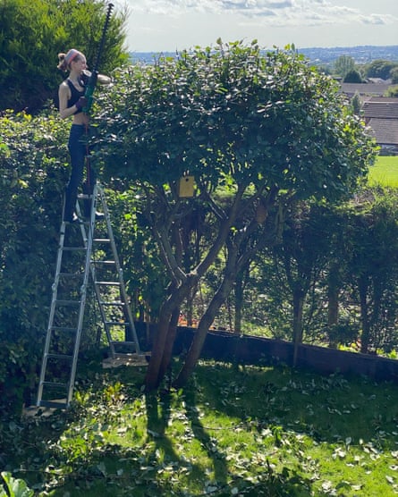 Natacha trimming a tree in summer 2021, a few months before she contracted Covid.
