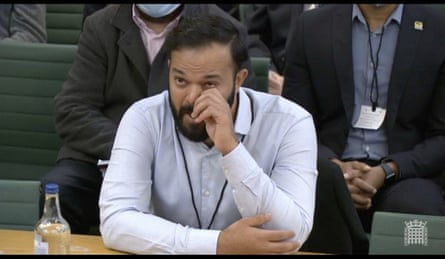 Rafiq wipes his eyes as he speaks to a parliamentary committee in 2021.