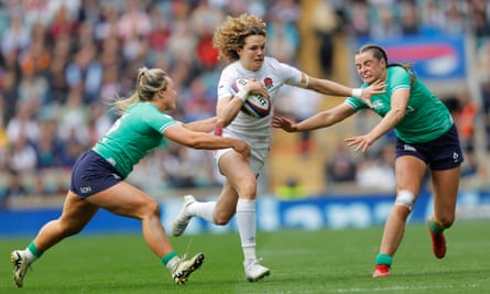 Ellie Kildunne attempts to get past Aoife Dalton and Katie Corrigan during England’s 14-try Six Nations rout of Ireland in April 2024.