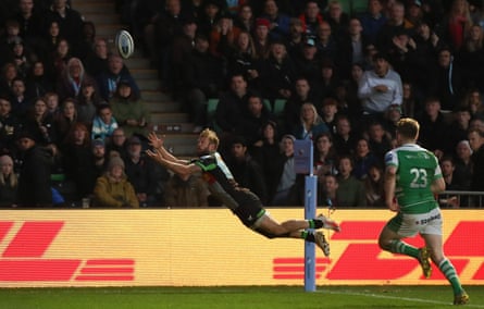 Tyrone Green of Harlequins scores a spectacular flying try during the Premiership Rugby match against Newcastle Falcons at Twickenham Stoop in November 2023.