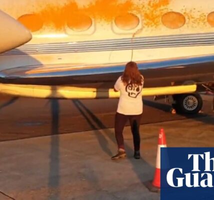 Two people arrested after activists spray private jets with paint at Stansted