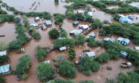 Aerial view of a flooded area with houses and buildings